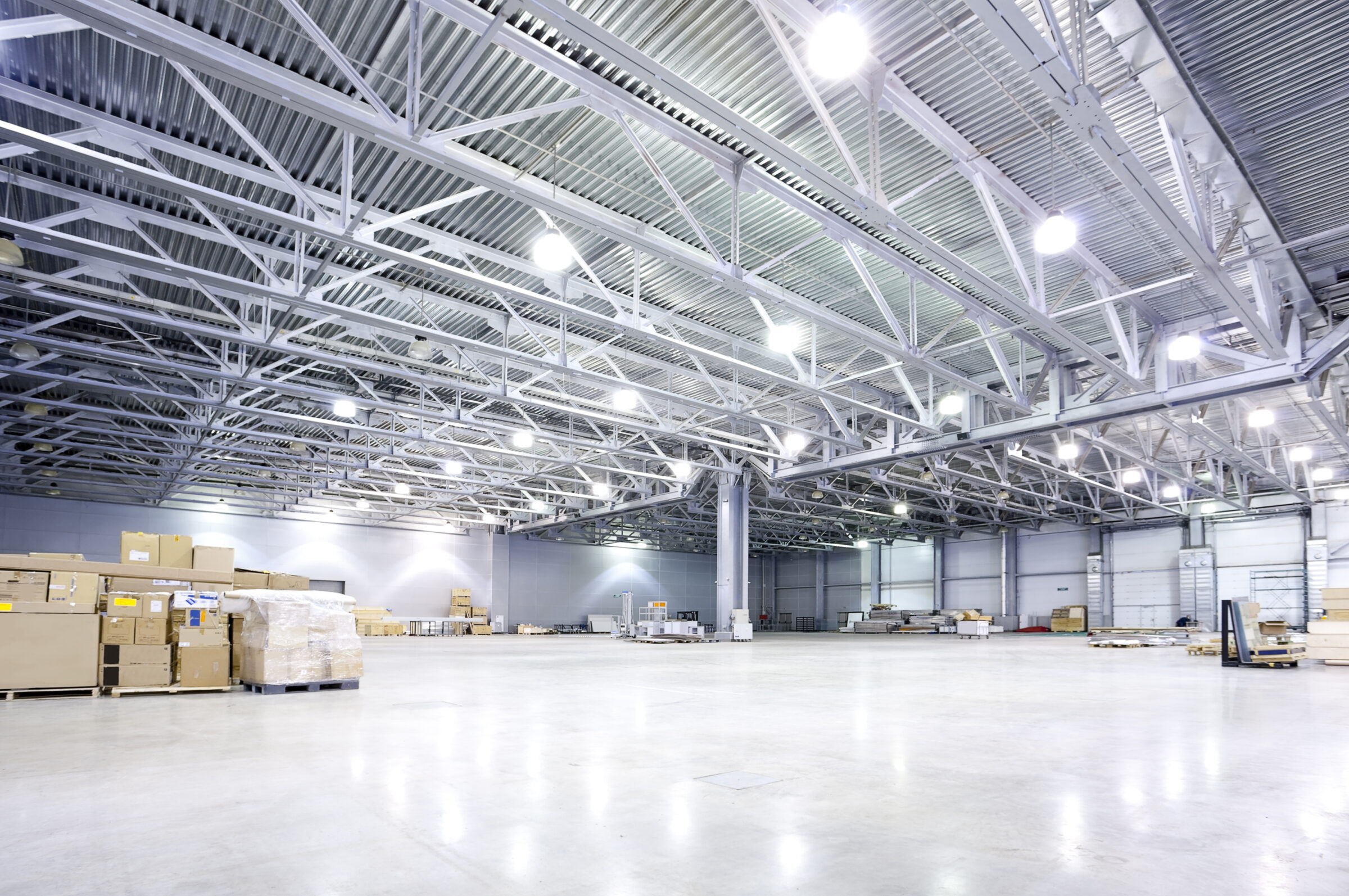 Modern commercial warehouse with professional electrical lighting systems
